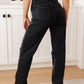 Susannah High Rise Rigid Magic 90's Distressed Straight Jeans in Black